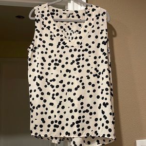 Off-white and black polka dotted sleeveless blouse